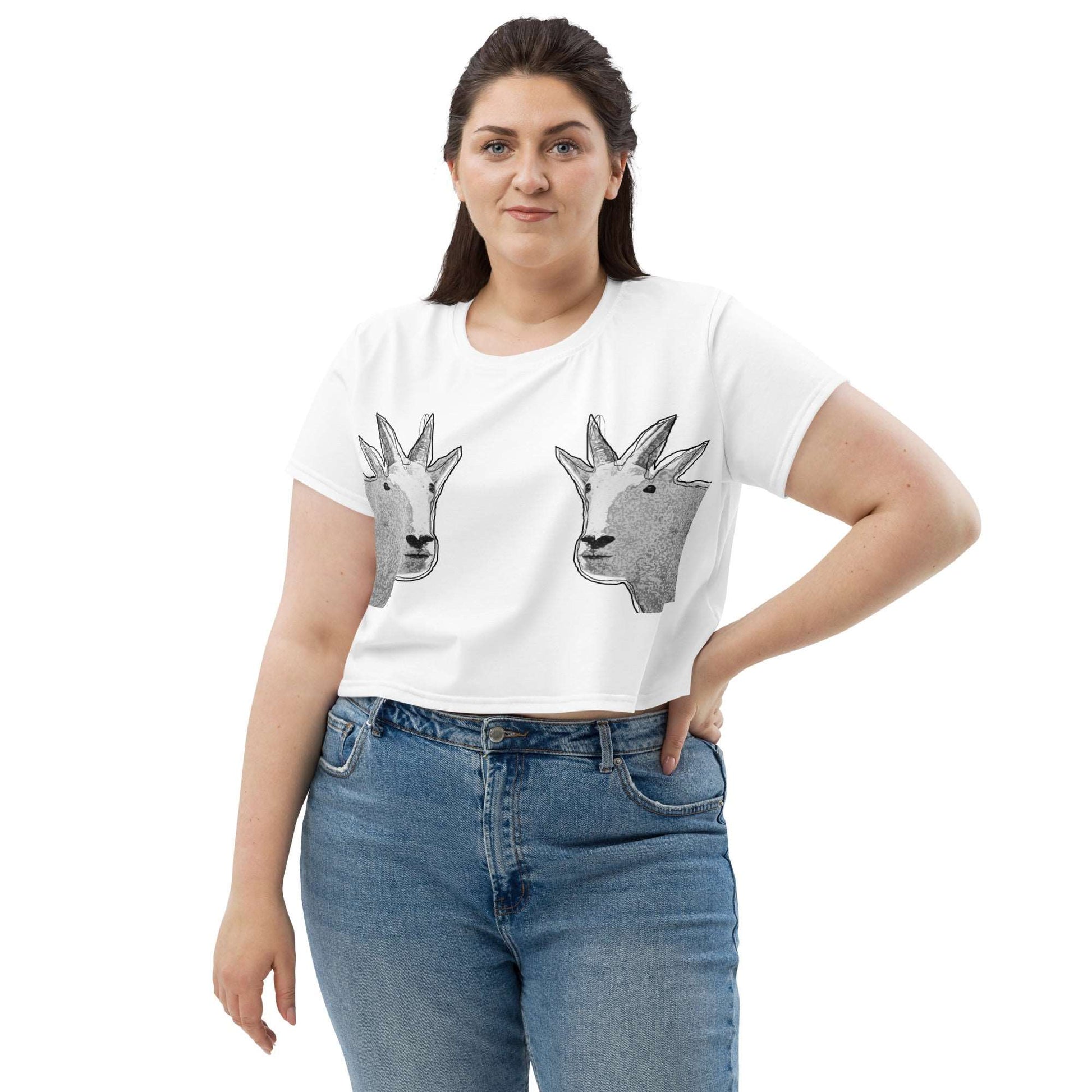 A plus-size female model wearing a white crop top that has two funny mountain goat images on the boobs. designed by North American Mountain Goat Appreciation Club.