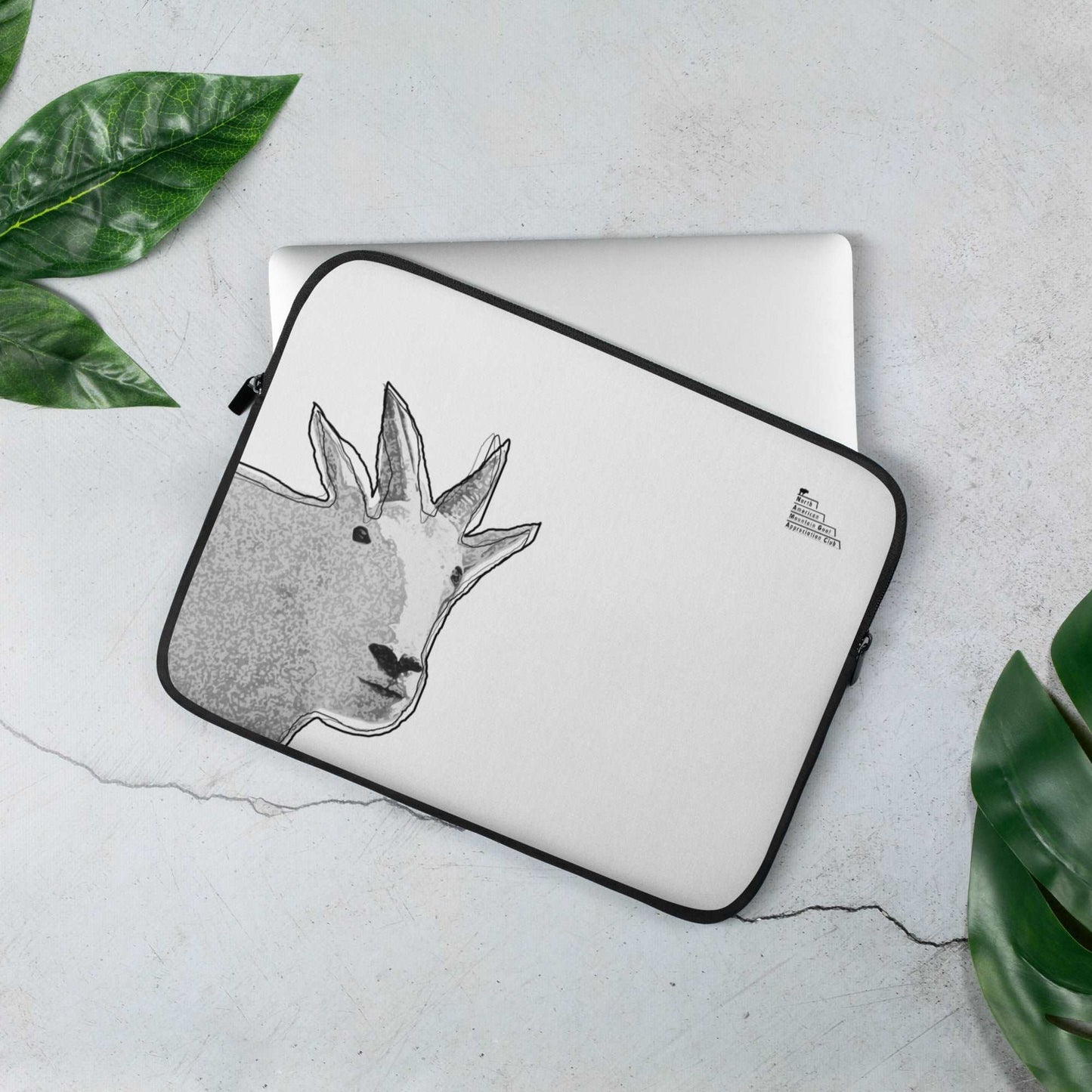 A 13-inch high quality laptop sleeve featuring a unique mountain goat design and a logo that reads "North American Mountain Goat Appreciation Club"