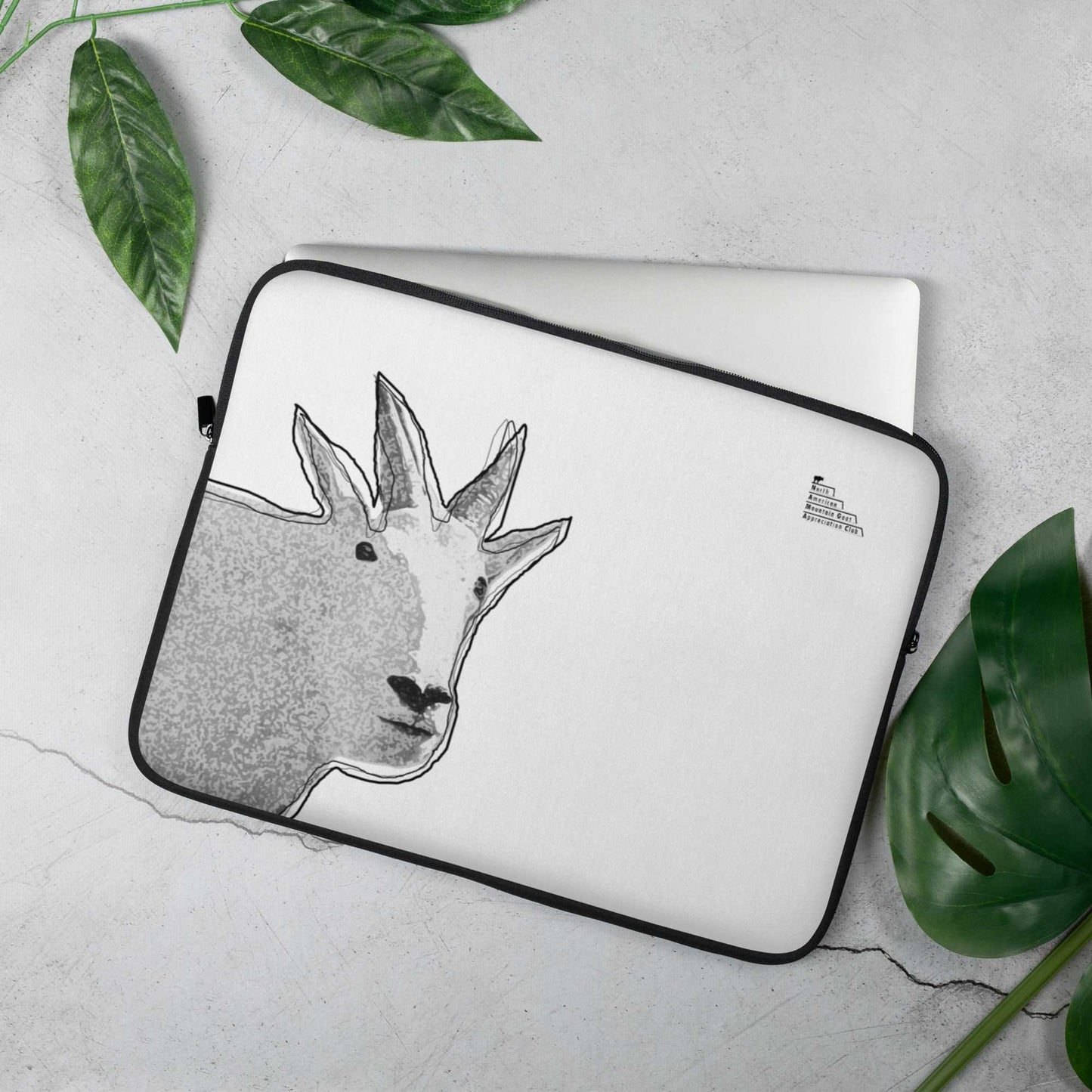 A 15-inch high quality laptop sleeve featuring a unique mountain goat design and a logo that reads "North American Mountain Goat Appreciation Club"