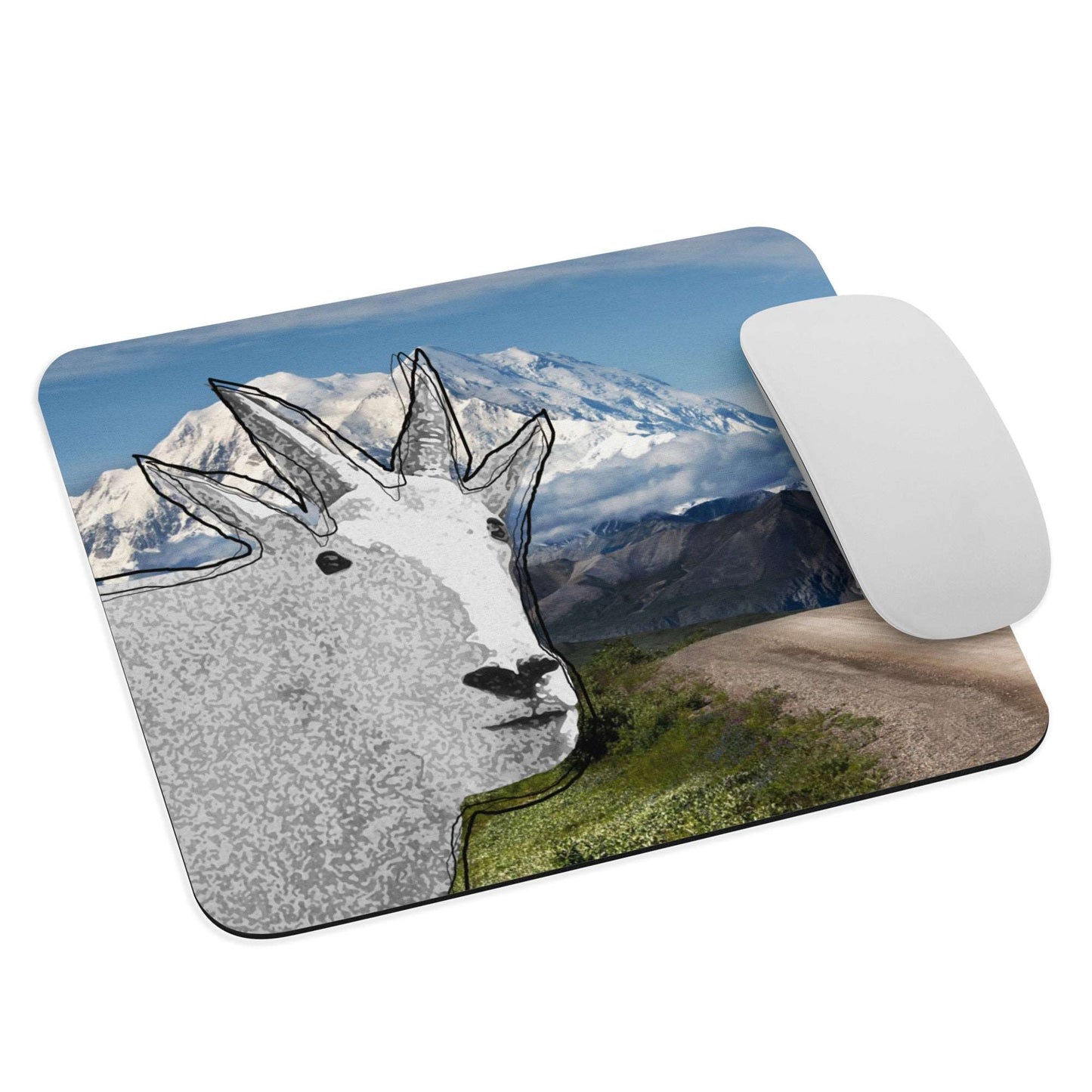 A high-quality mouse pad featuring a funny mountain goat design over a mountain view background.