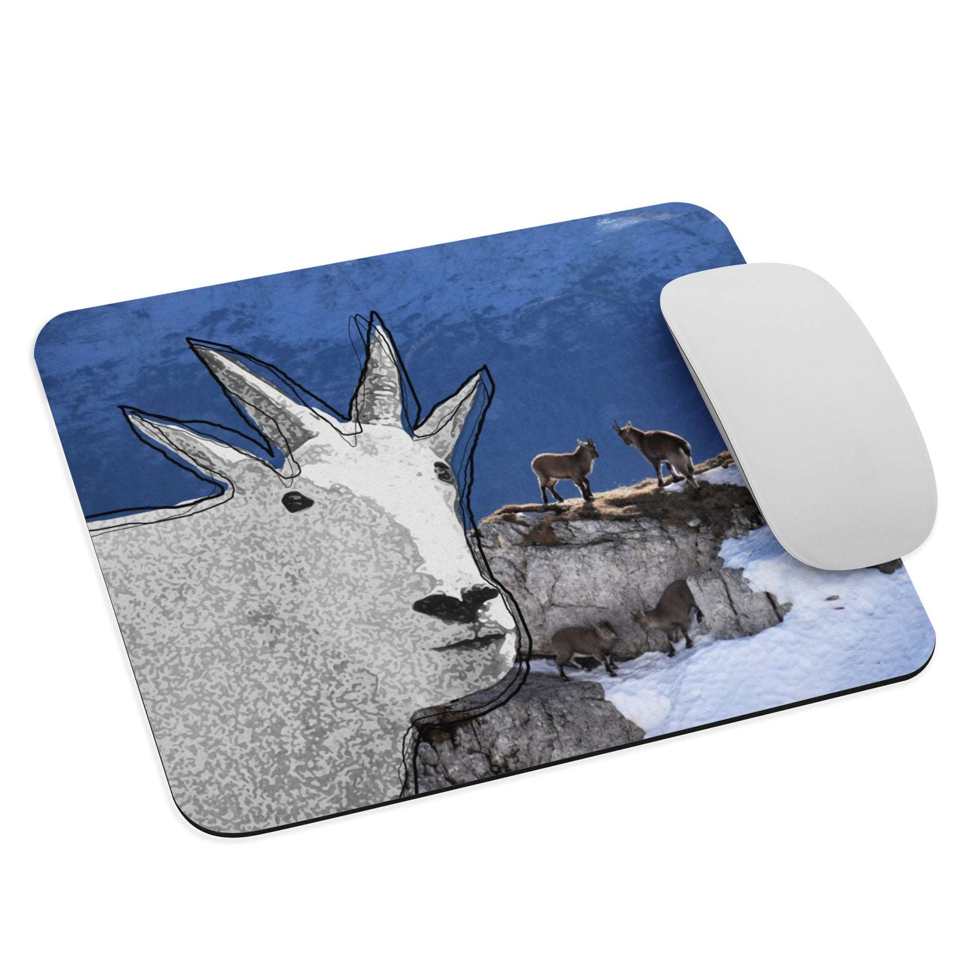 A high-quality mouse pad featuring a funny mountain goat design over a wildlife background.