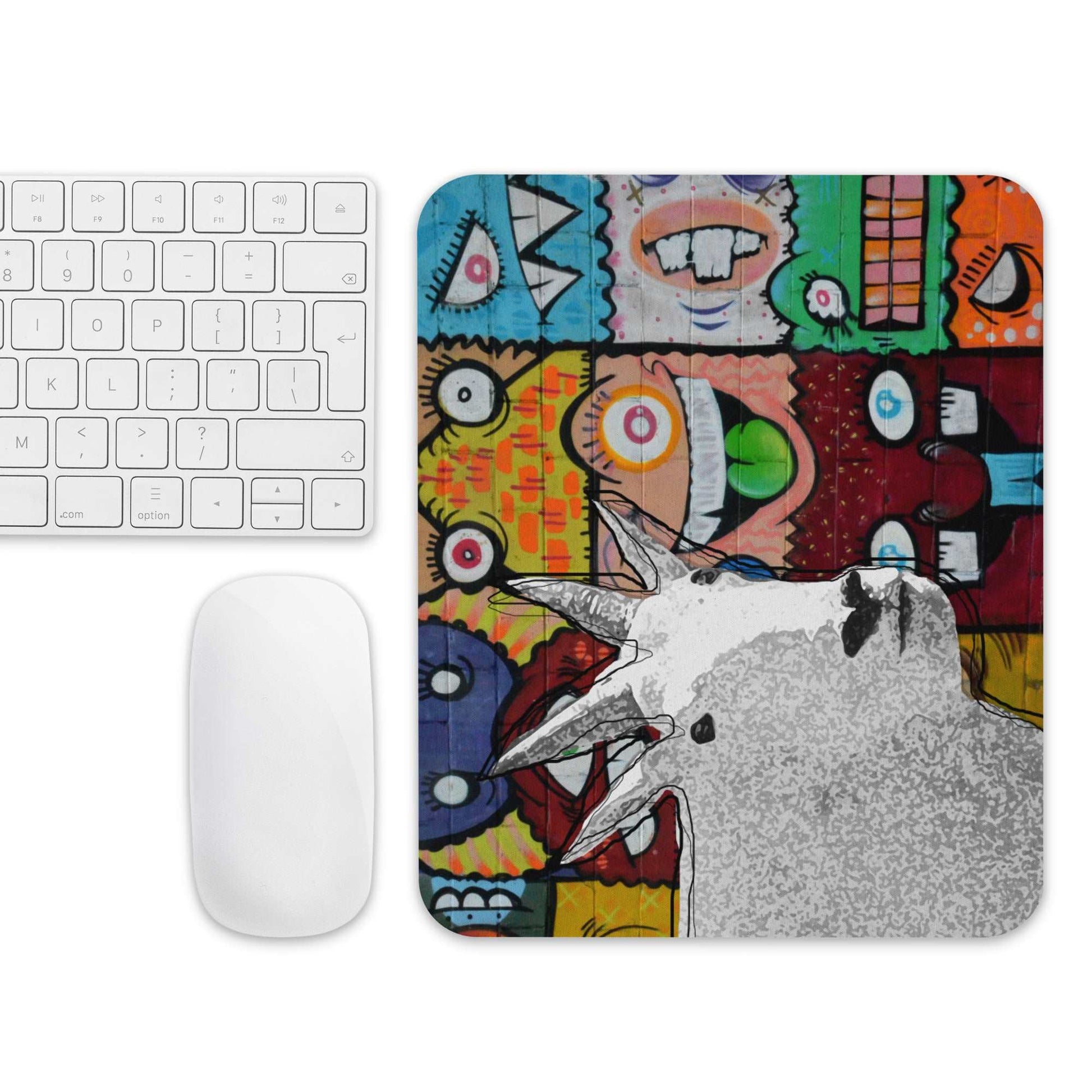 A high-quality mouse pad featuring a funny mountain goat design over a funky street art background.