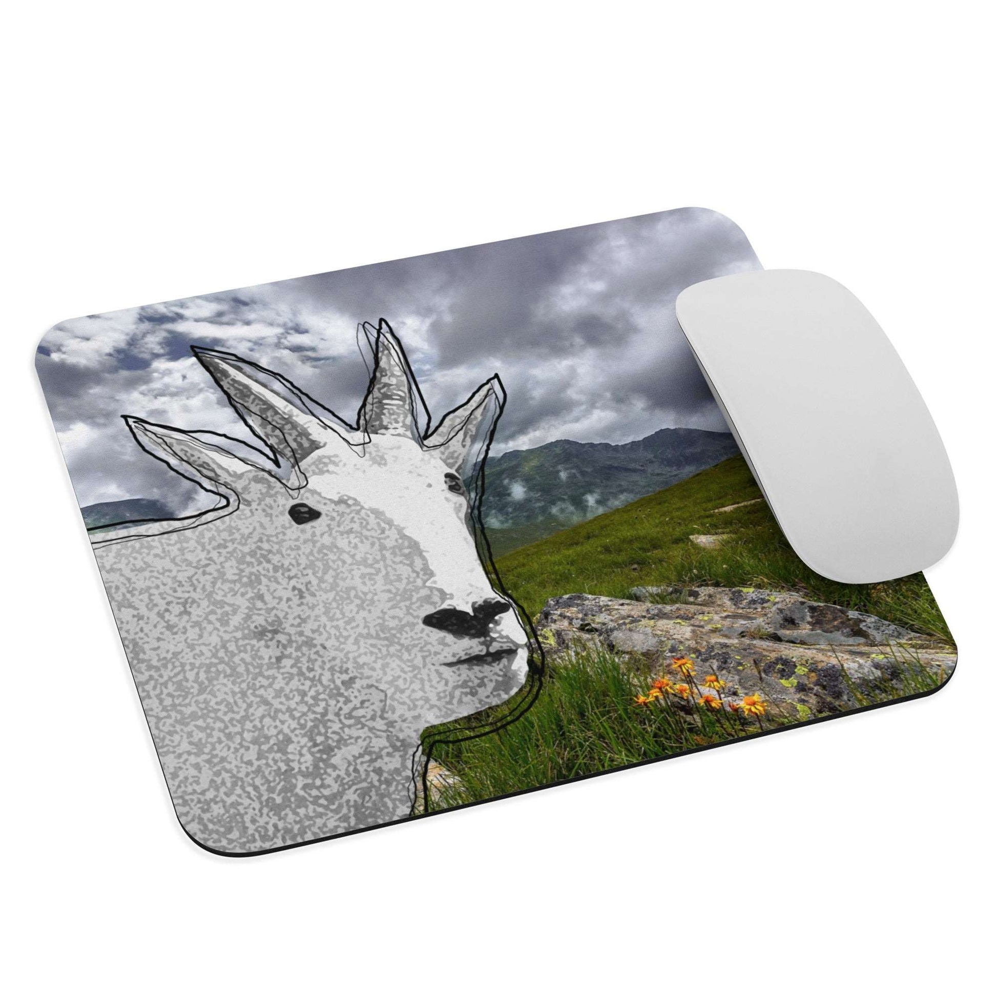 A high-quality mouse pad featuring a funny mountain goat design over Mt Rainer background.