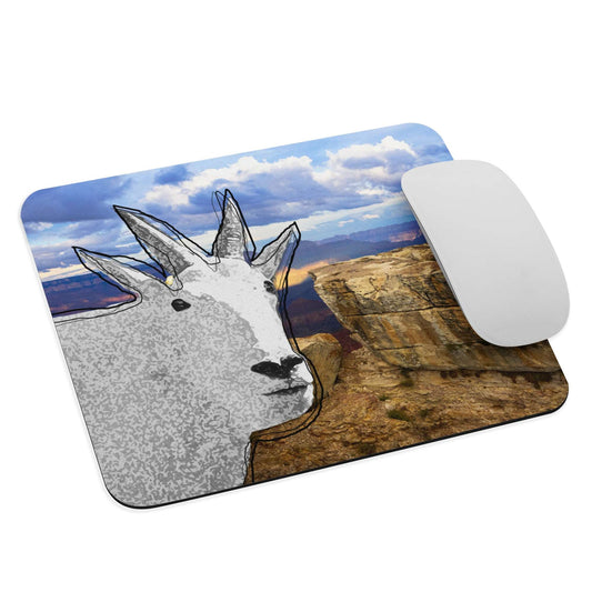 A high-quality mouse pad featuring a funny mountain goat design over panorama background.