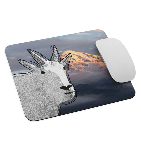 A high-quality mouse pad featuring a funny mountain goat design over a misty mountain background.