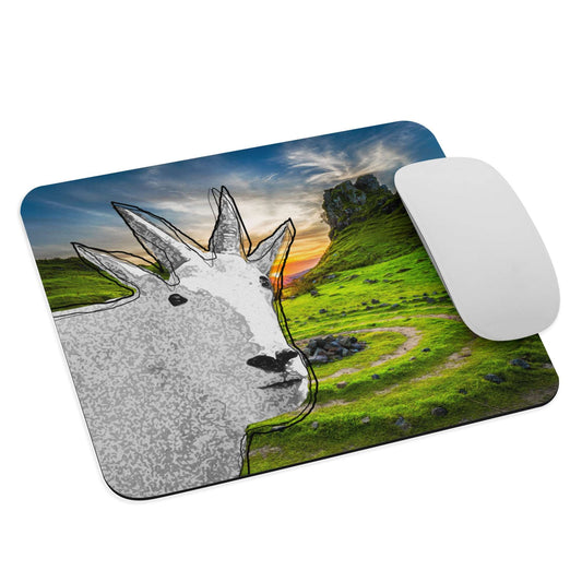 A high-quality mouse pad featuring a funny mountain goat design over a green mountain background.