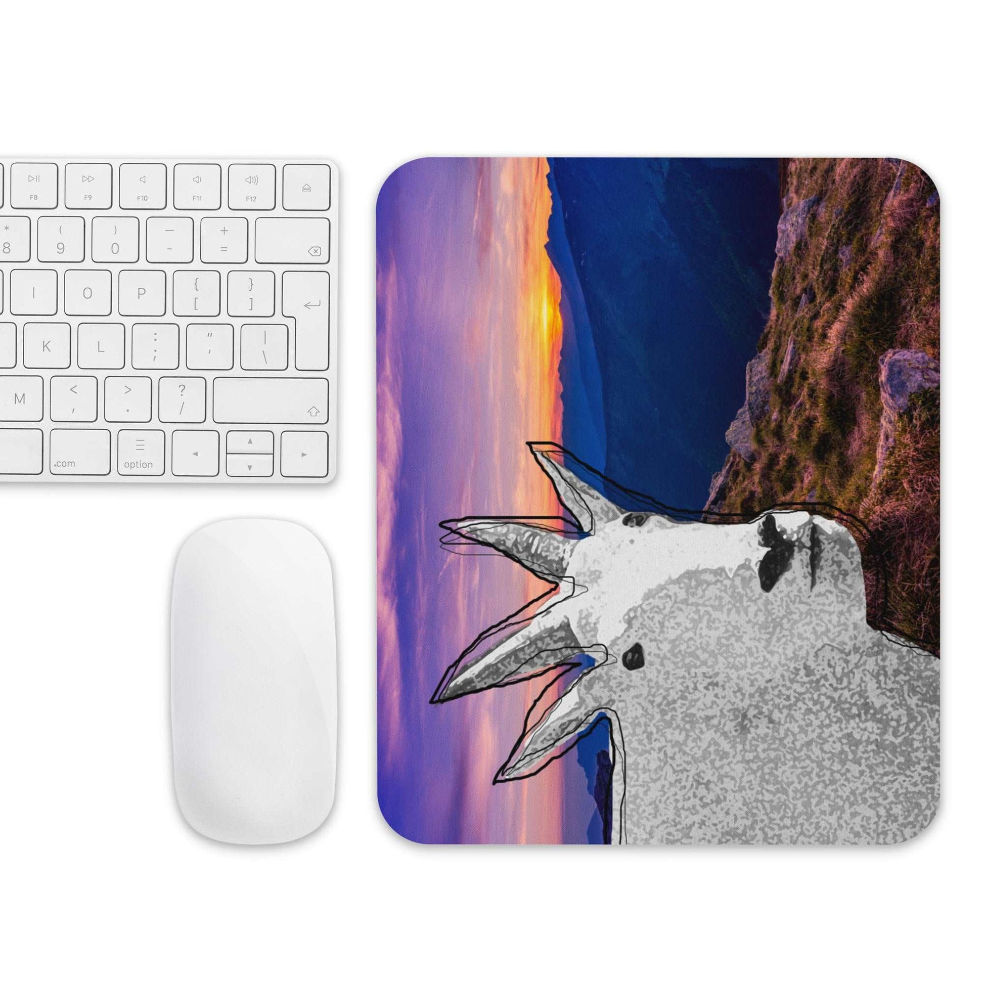 A high-quality mouse pad featuring a funny mountain goat design over a gorgeous sunset background.