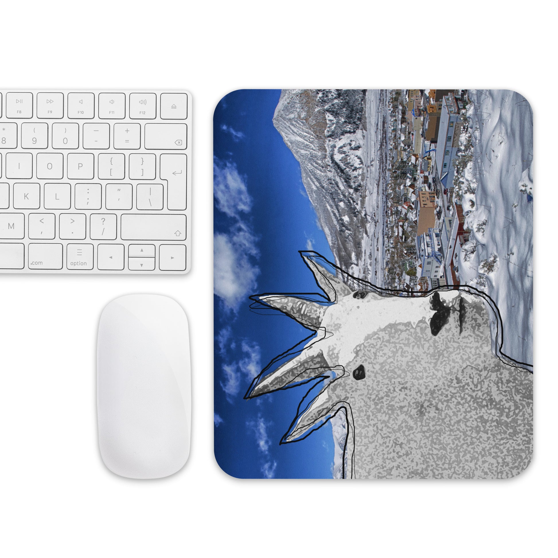 A high-quality mouse pad featuring a funny mountain goat design over a frosty village background.