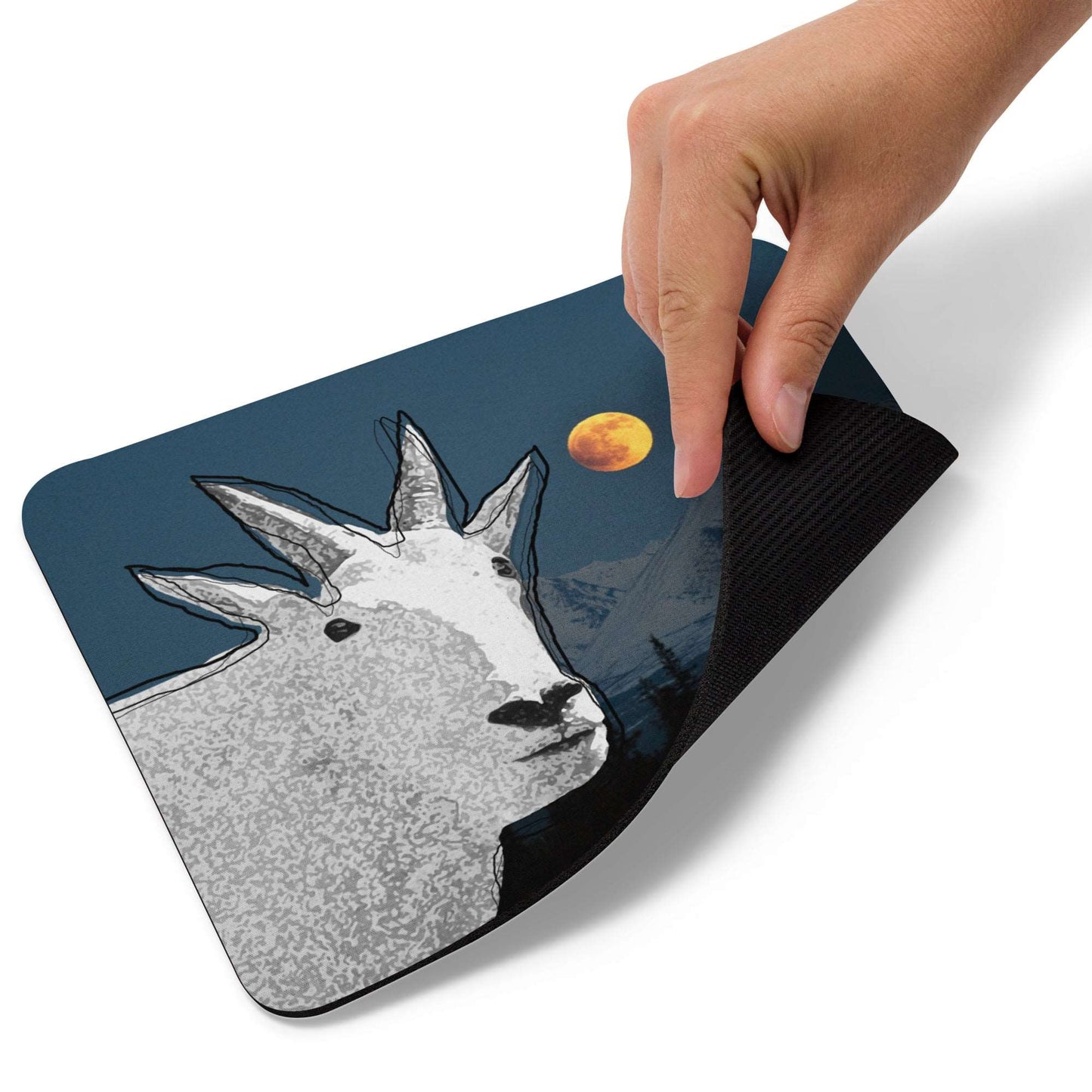 A high-quality mouse pad featuring a funny mountain goat design over a full moon background.