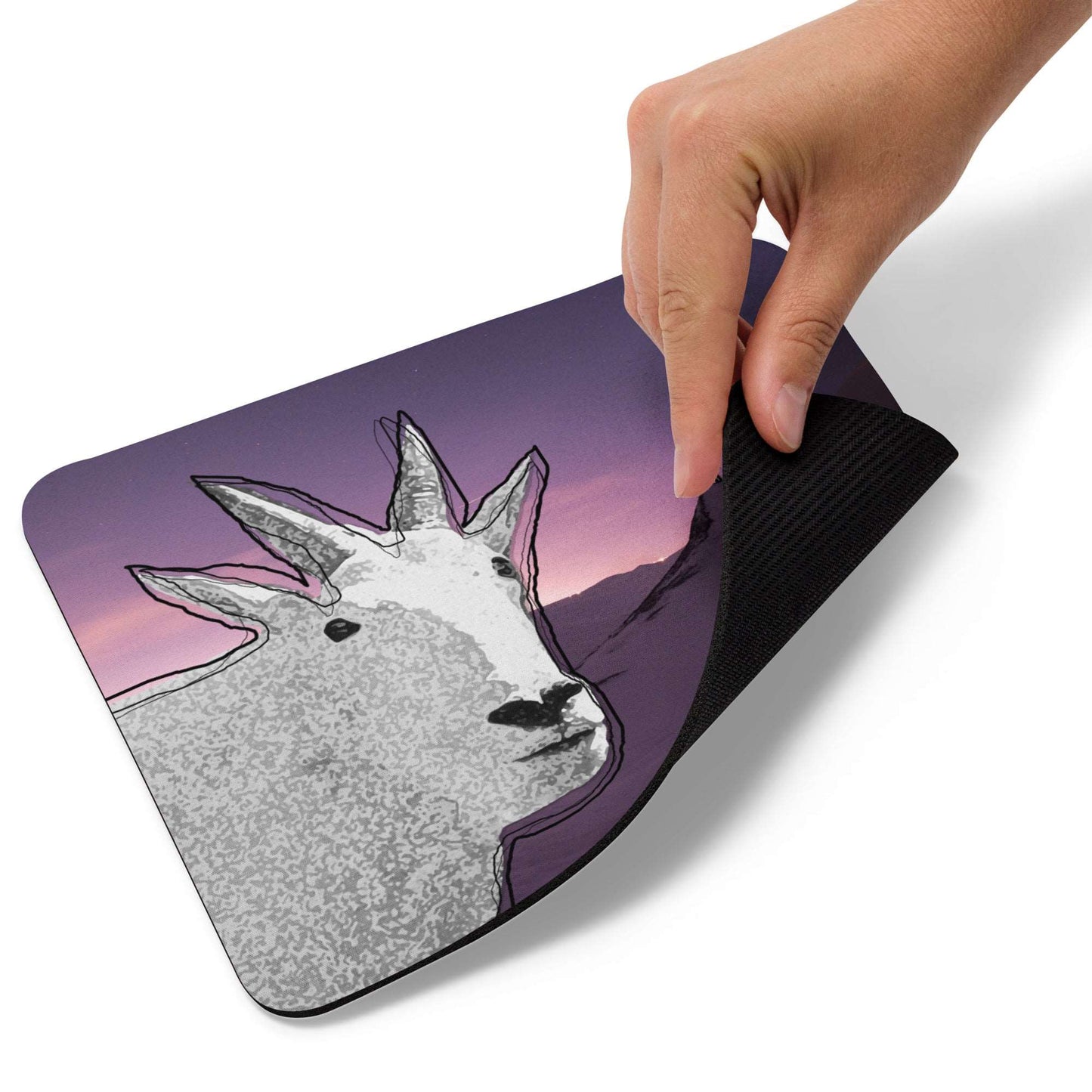 A high-quality mouse pad featuring a funny mountain goat design over purple snowy trek background.