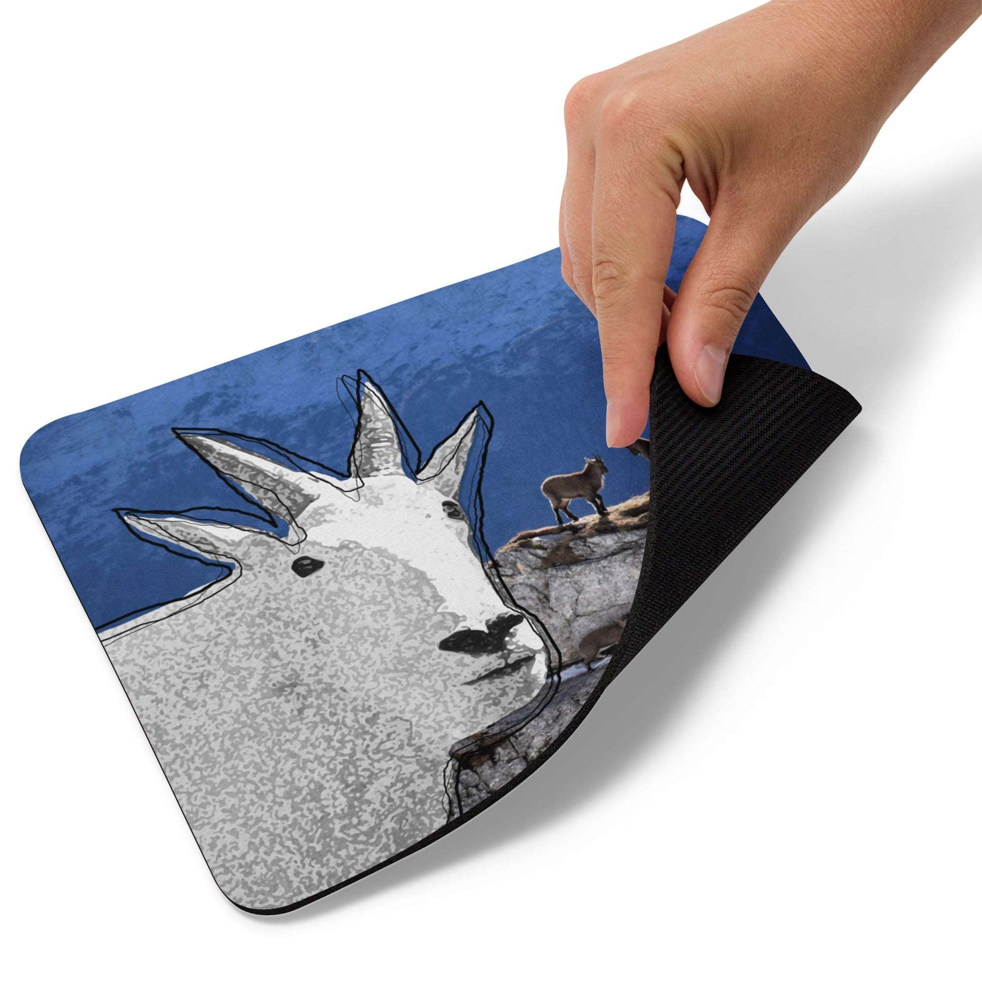 A high-quality mouse pad featuring a funny mountain goat design over a wildlife background.