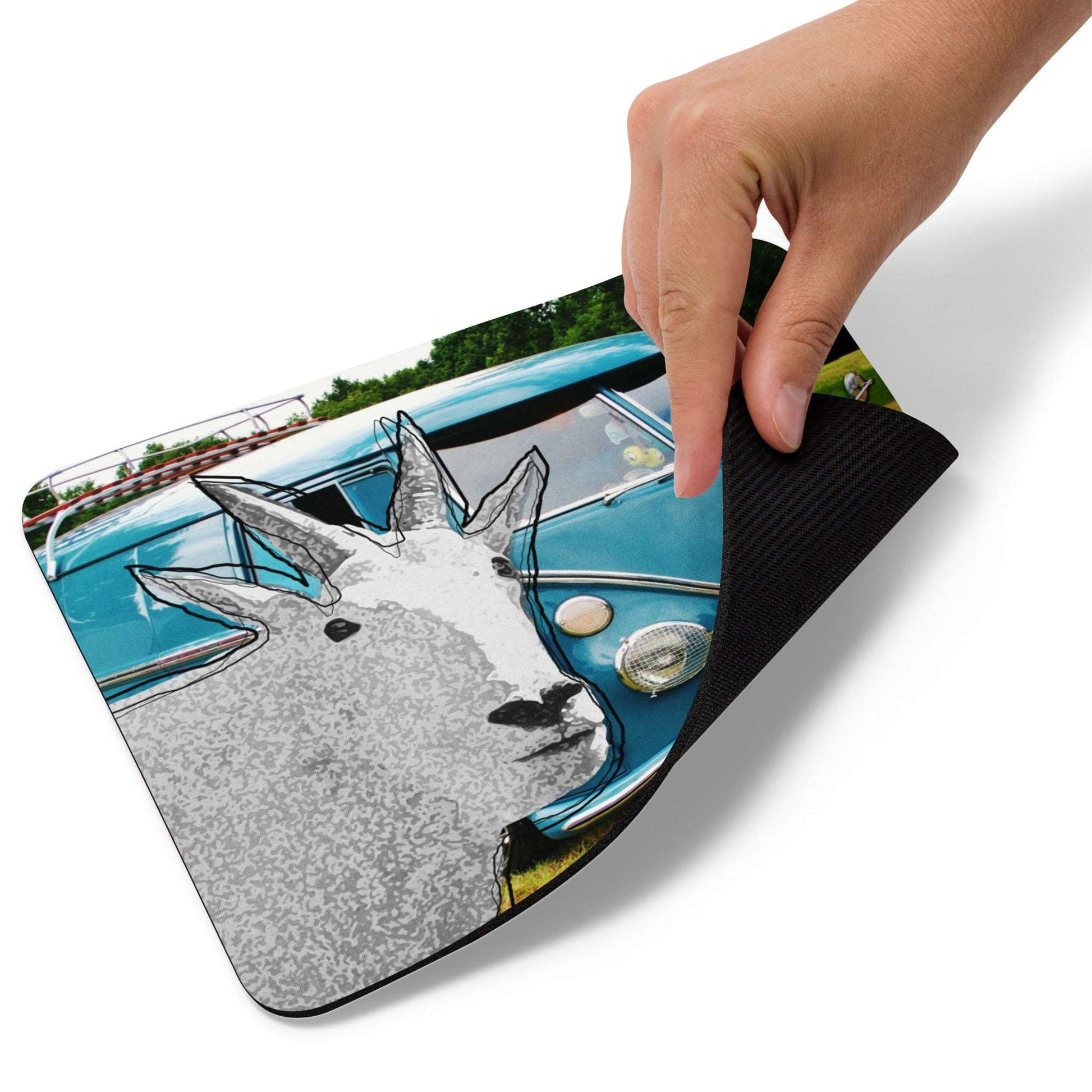 A high-quality mouse pad featuring a funny mountain goat design over a blue vintage Volkswagen background.